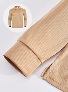 Close-up of khaki long sleeve polo shirt showing breathable mesh fabric and hem slit