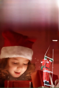 Detail of Santa Claus climbing ladder and rope ornaments in festive red and white colors