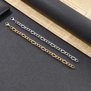 Close-up of hip hop style chunky link bracelets in gold and silver finish with lobster clasp