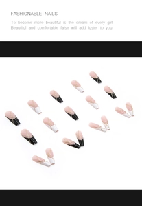 Detail of long ballerina press-on nails with nude base, black tips and gold glitter lines