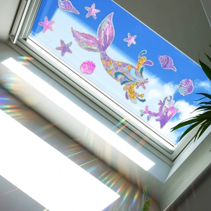 Rainbow holographic mermaid tail window decals reflecting vibrant sun light and colors