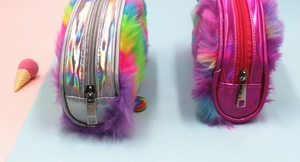 Close-up of rainbow plush pencil cases with holographic silver and metallic pink panels