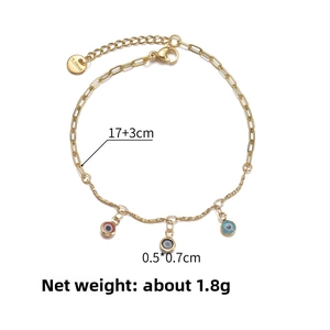 Macro detail of 14K gold stainless steel chain with colorful evil eye charms, 1.8g weight