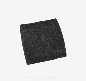 Detail view of charcoal grey knit neck warmer with ribbed edges and soft texture