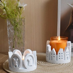 Detail of bunny heart and house design plaster candle holders with aromatherapy glass