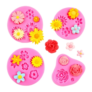 Pink floral silicone mold set featuring daisy and rose designs for fondant and chocolate