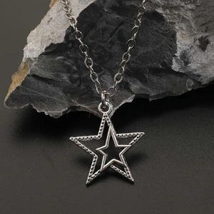 Men's hip hop silver star pendant necklace with double-layer hollow design on black rock