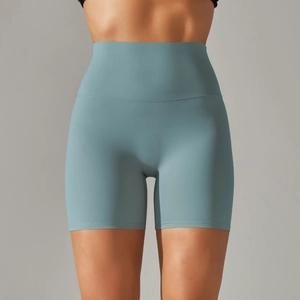 Front view of high waisted fitness shorts in light blue with tummy control seamless design