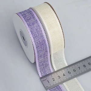 Close-up of 25mm wide woven linen-style ribbons in light purple and beige tones