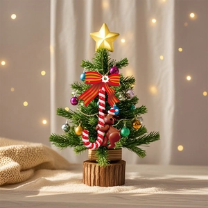 Christmas tree hanging ornament featuring candy cane and reindeer on a warm festive background