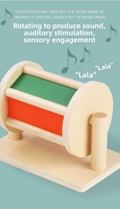Detail of colorful wooden spinning drum toy for sensory and auditory development