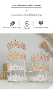 Detail of gold, rose gold and silver crowns with rhinestones on a white metal display rack