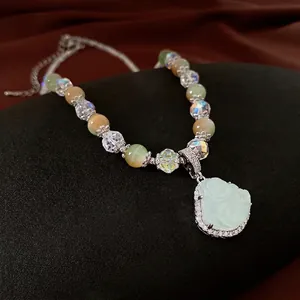 Zircon Buddha pendant beaded necklace with light green jade beads and crystal accents
