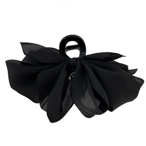 Elegant French style black satin bow hair claw clip for a sophisticated ponytail look