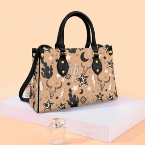 Detail view of khaki PU leather western tote bag with black accents on a white stand