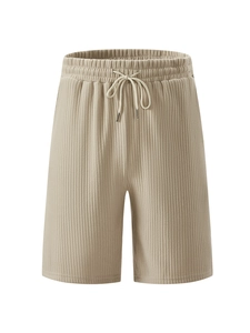 Detail of corduroy texture and elastic drawstring waistband on men's casual shorts