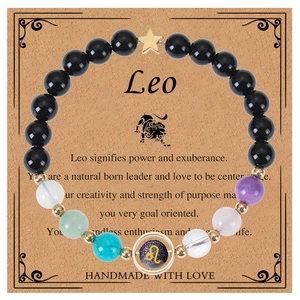 Detail of Leo zodiac bracelet with colorful natural stones and star charm on gift card