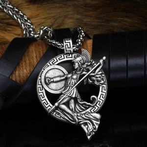 Close-up of Viking World Tree necklace with Norse warrior pendant on fur background