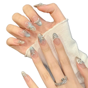 Blue cat eye press-on nails with silver bows, pearls and crystals decoration