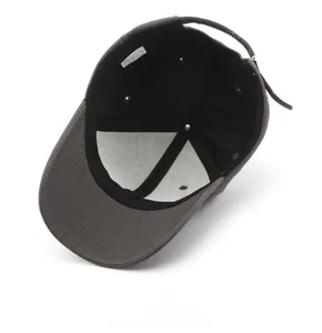 Detailed interior of dark grey cotton baseball cap showing sweatband and washing label
