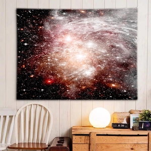 Cosmic galaxy wall tapestry with nebula star clusters hung on a light wood wall