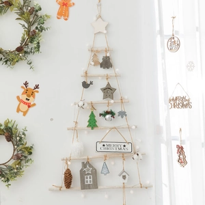 Handmade wall-mounted wooden Christmas tree with rustic ornaments and Merry Christmas sign