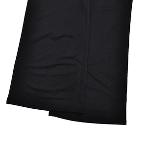 Detail view of the black slim-fit jumpsuit hem showing soft fabric and fine stitching