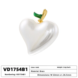 Macro shot of 22x26mm heart shell pearl charm with brass gold leaves for DIY jewelry
