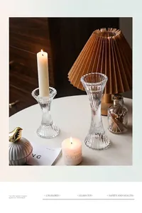 Detailed view of two vintage fluted glass candle holders with elegant ribbed texture