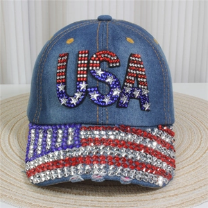 Detail of denim baseball cap featuring American flag rhinestone USA embellishment
