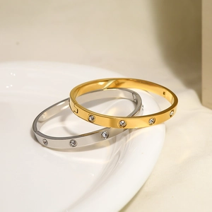 Minimalist titanium steel bangles with clear crystals in gold and silver finish