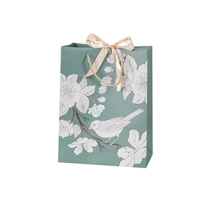 Teal green floral gift bag with bird illustration and champagne ribbon bow handle