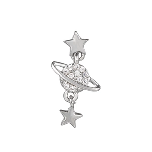 Macro detail of silver star and Saturn pendant with pave white rhinestones