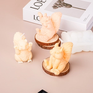 Detailed view of squirrel silicone candle molds with finished orange animal ornaments