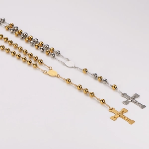 Minimalist cross pendant rosary necklace with gold and silver beaded chains on white background