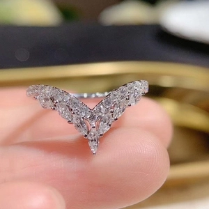 Elegant V-shaped ring with marquise and round cut white crystals in silver finish