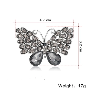 Detail of crystal butterfly brooch with dimensions 4.7cm by 3.2cm and weight 17g
