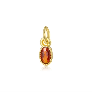 Pendentif doré élégant avec pierre de zircon ovale rouge et bélière sur fond blanc