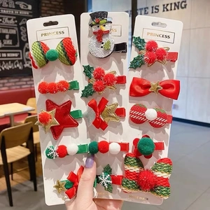 Handmade Christmas hair clip set for girls with snowman and tree patterns on cards