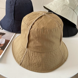 Waterproof nylon bucket hats for men and women with cross-stitch design and wide brim