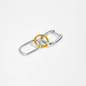 Detailed close-up of S925 sterling silver stamp on two-tone gold and silver hoop earrings