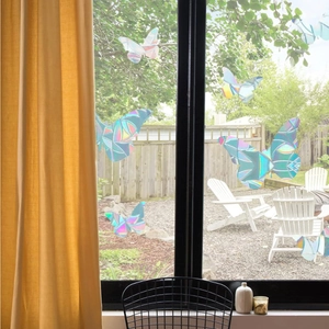 Rainbow prism static glass butterfly window stickers reflecting colorful sunlight in home