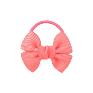 Close-up of pink grosgrain ribbon bow hair tie with elastic band on white backdrop
