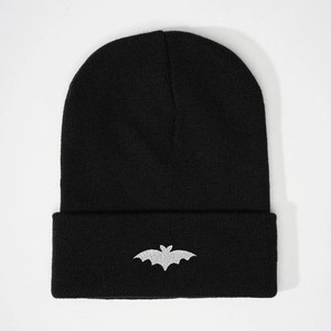 Black knit beanie with embroidered silver glitter bat pattern and folded cuff design