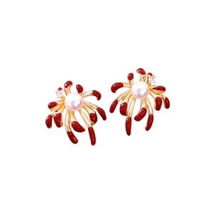 Elegant gold plated fireworks earrings with red enamel petals and central pearls