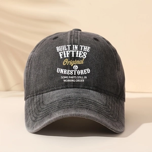 Vintage washed black baseball cap with retro typography on a minimalist background
