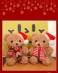 Detailed view of brown plush teddy bears wearing festive red and white Christmas hats