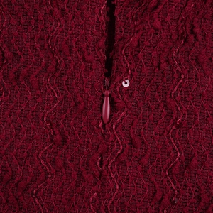 Macro shot of dark red textured tweed evening dress with a matching invisible zipper