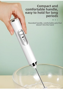 Close-up of portable cordless electric milk frother being held above a foamy bowl