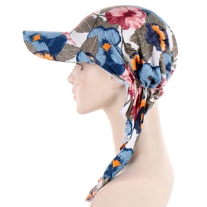 Detail of floral headscarf hat with side straps and colorful fabric pattern